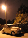 SX25881 Old car covered in snow parked under street light Llantwit Major.jpg